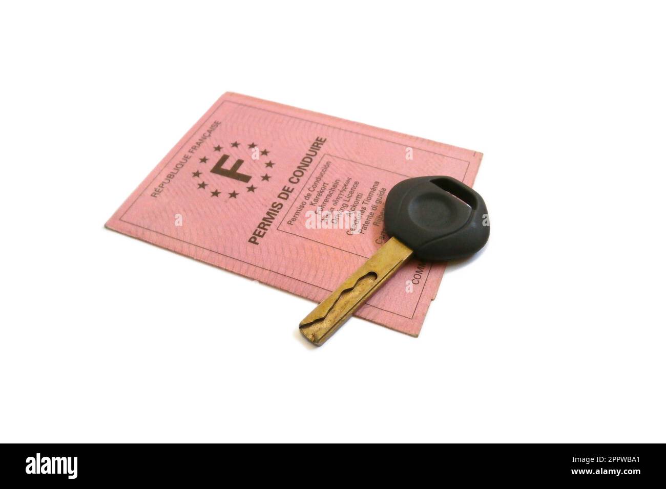 Studio shot of a French driver's license and car key on white background Stock Photo