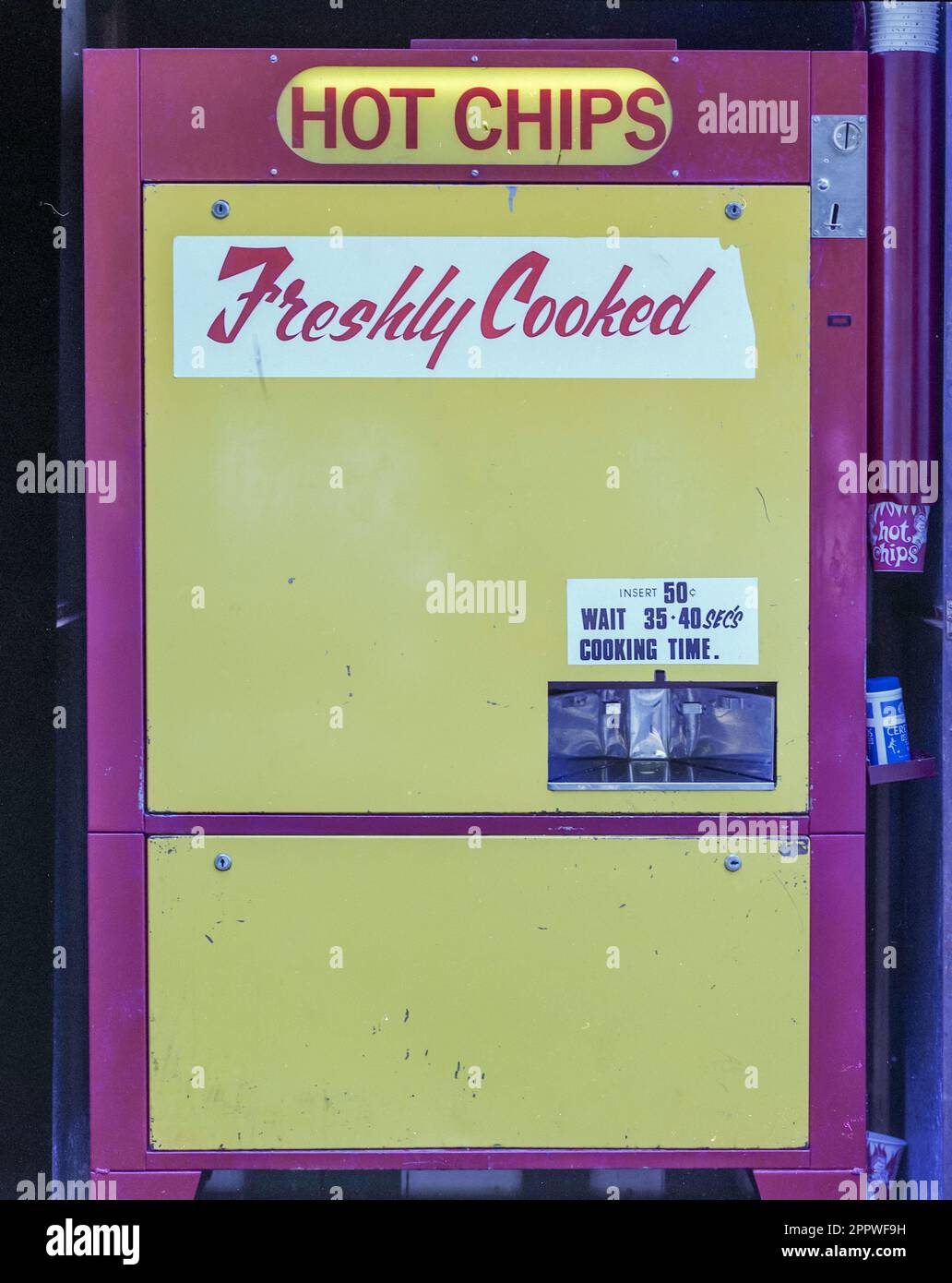 A 1981 historic image of a Hot Chip vending machine in Christchurch on the south island of New Zealand. Stock Photo