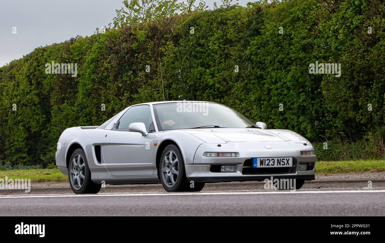 Bicester,Oxon,UK - April 23rd 2023.2000 silver HONDA NSX  car travelling on an English country road Stock Photo