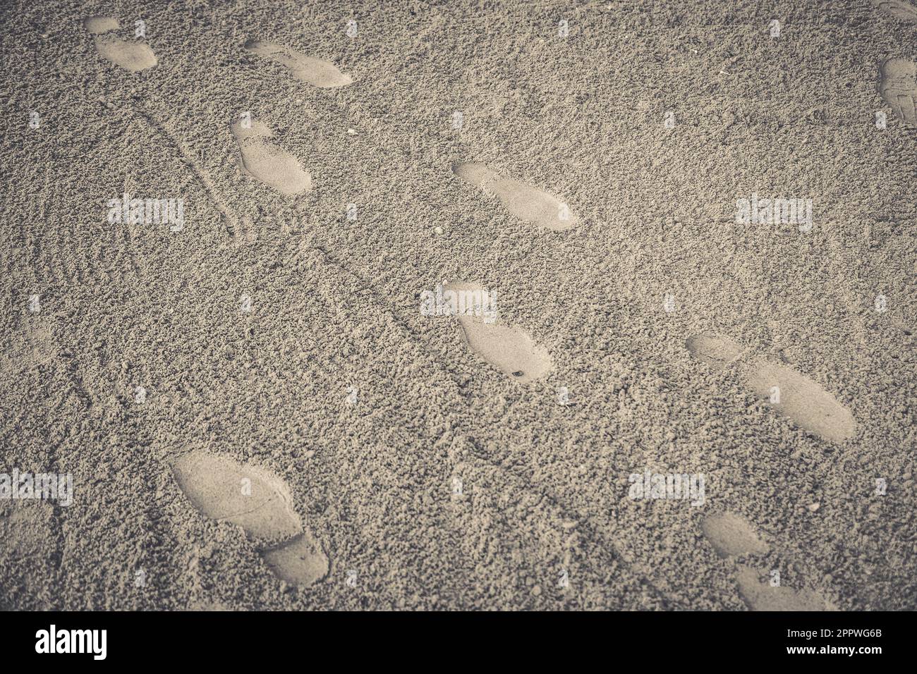 Footprint on sand beach background Stock Photo