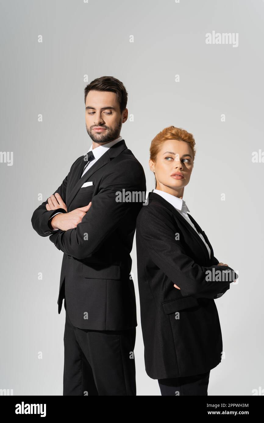 Black suits standing hi-res stock photography and images - Alamy