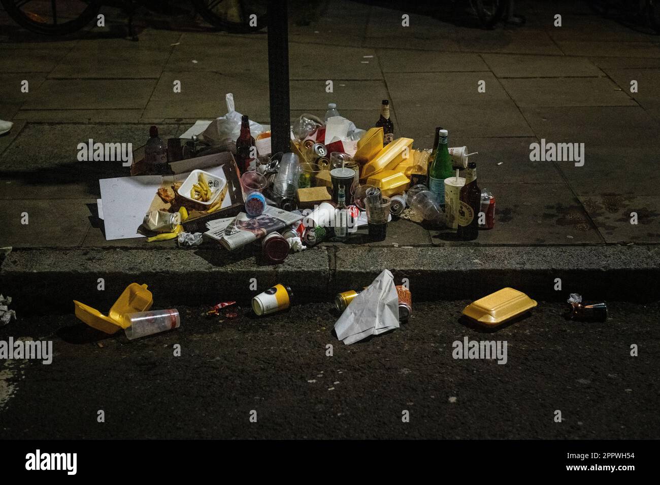 Rubbish, garbage, trash, outside onsite book, pavement London Stock