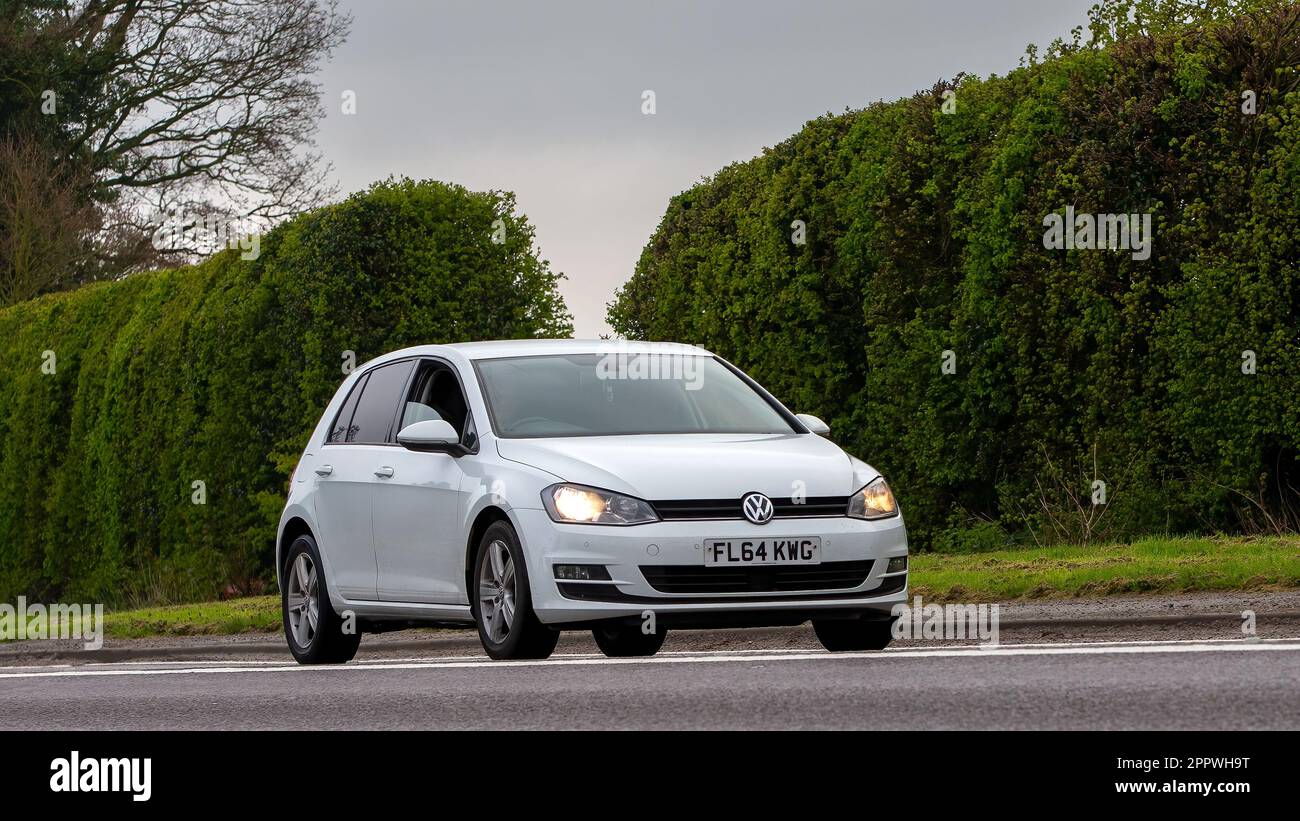 Bicester,Oxon,UK - April 23rd 2023. 2014 white VOLKSWAGEN GOLF car  travelling on an English country road Stock Photo - Alamy