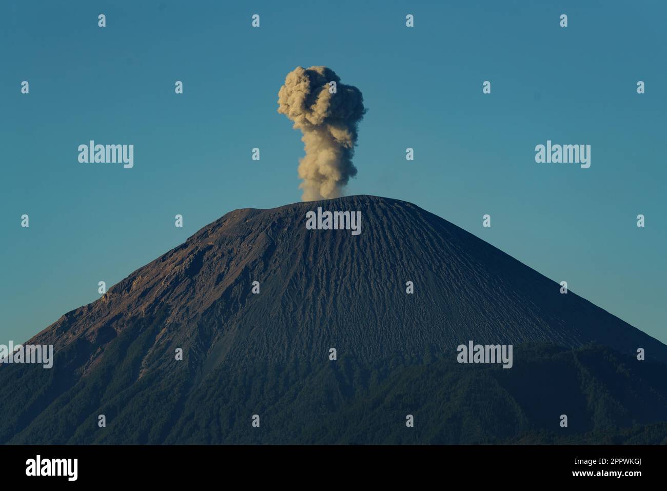 Smoke coming out of Mt Bromo at sunrise, Indonesia Stock Photo