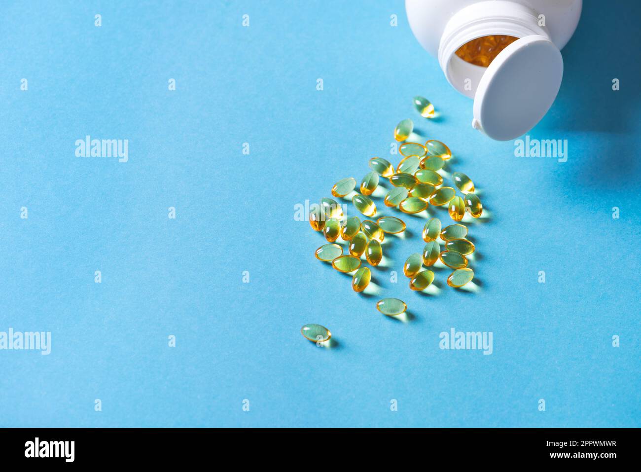Oil filled capsules (softgel) of food supplements: fish oil, omega 3, omega 6, omega 9, vitamin A, vitamin D3, vitamin E, evening primrose oil, borage Stock Photo