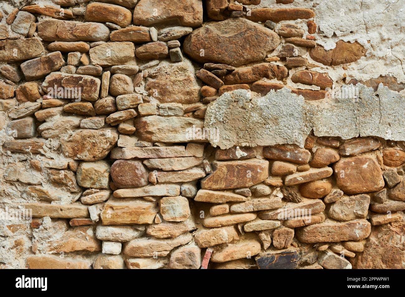 Ancient stone rough facade Stock Photo