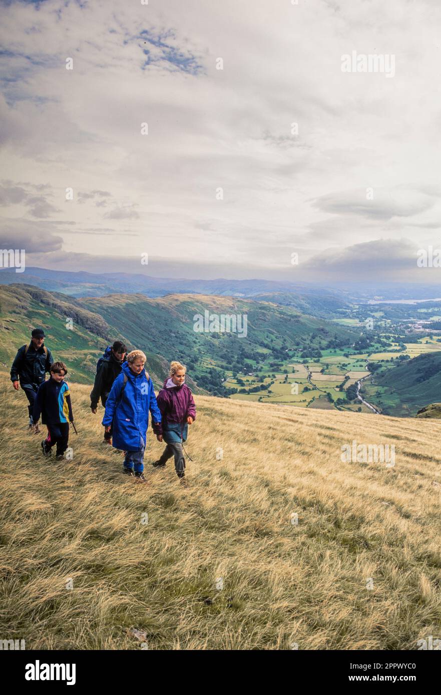 Group of caucasian walkers on the fells of the Dungeon Ghyll, Cumbria. UK Stock Photo