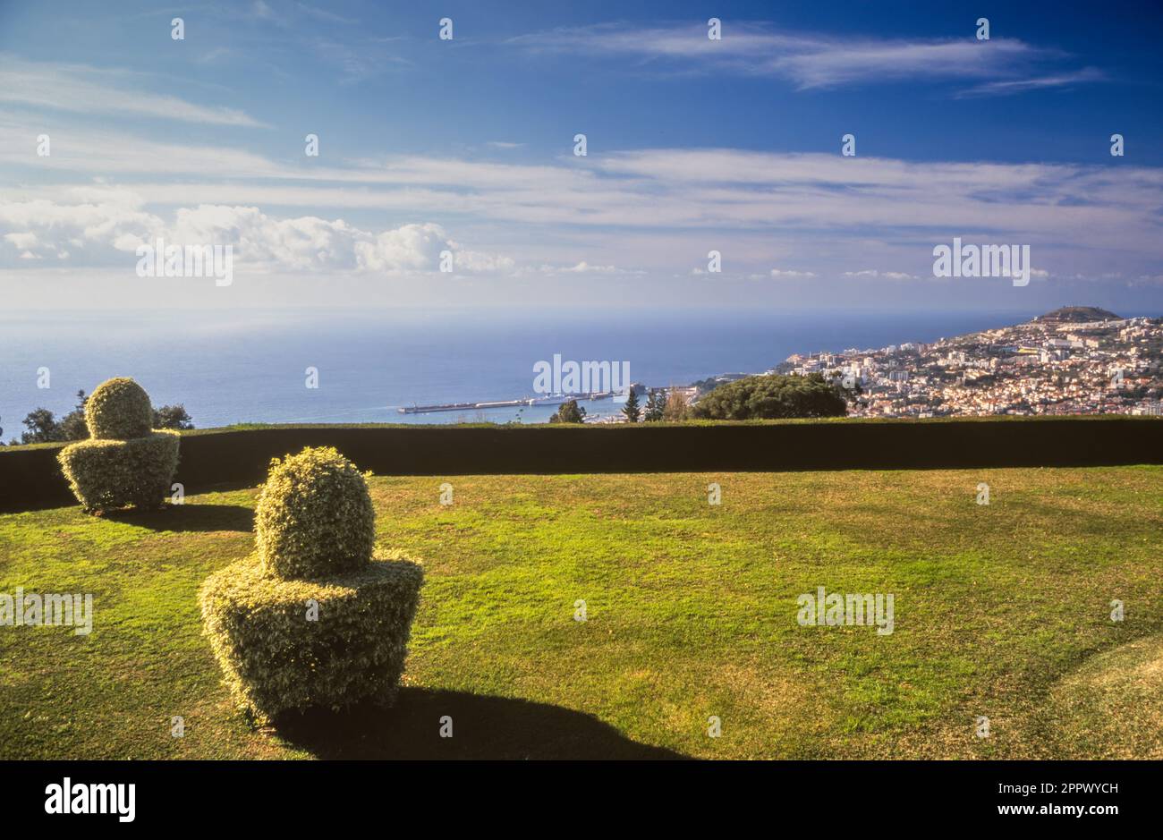 Archive image of topiary in Madeira Botanical Garden, with the Atlantic ocean and the town of Funchal in the distance. Stock Photo
