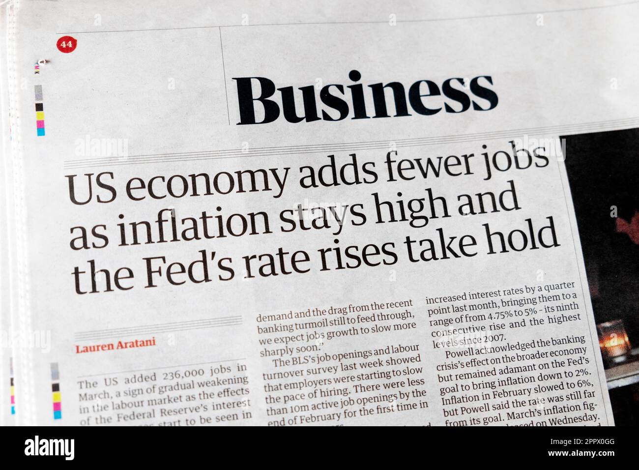 'US economy adds fewer jobs as inflation stays high and the Fed's rate rises take hold' Guardian newspaper headline article 8th April 2023 London UK Stock Photo