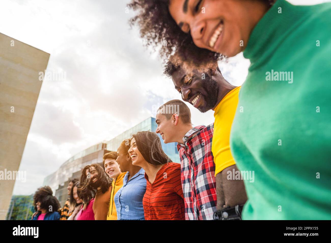 Young diverse people having fun outdoor laughing together - Focus on ...