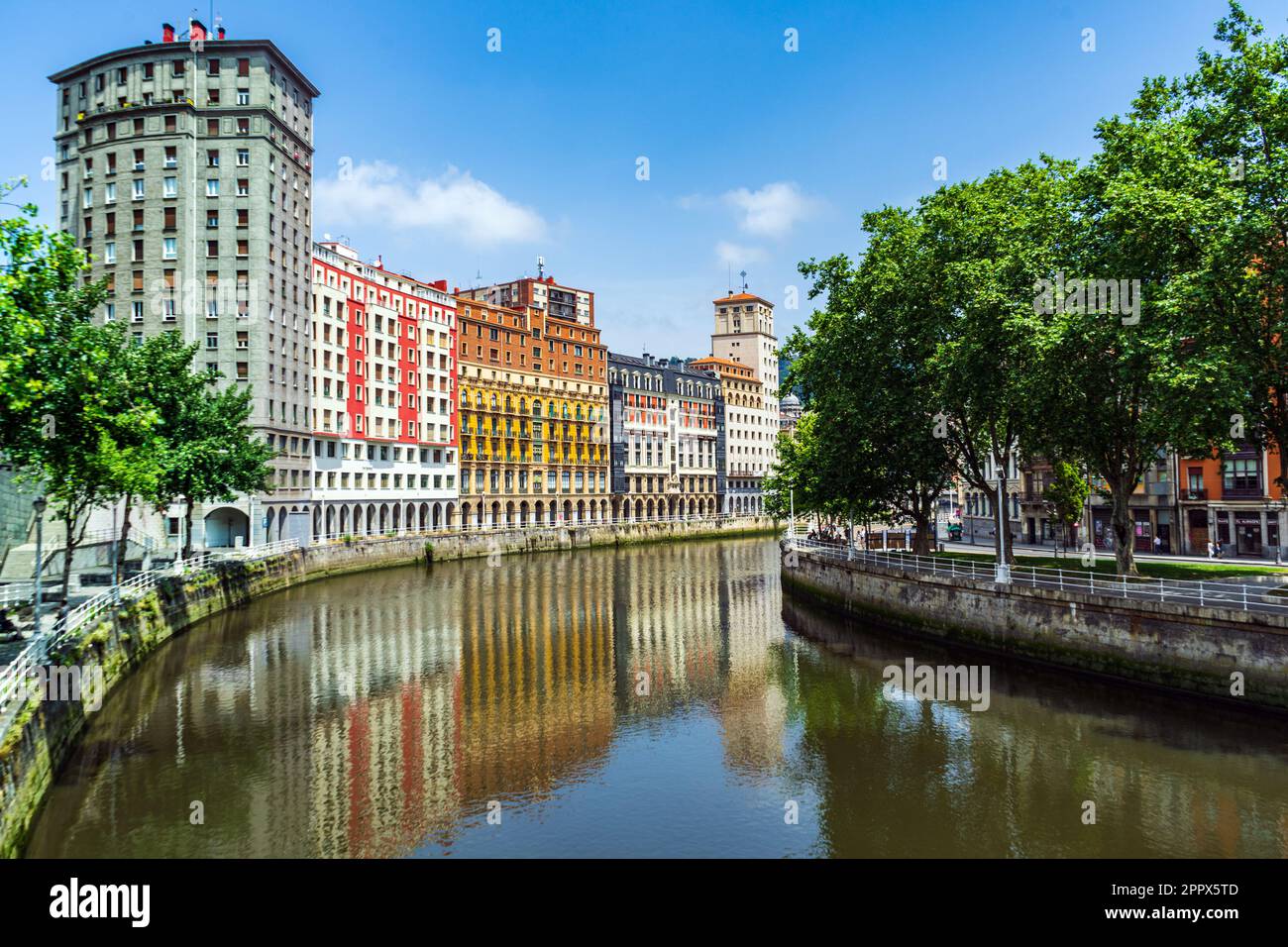 High Bright multi colored houses apartment buildings along the Nervion ...