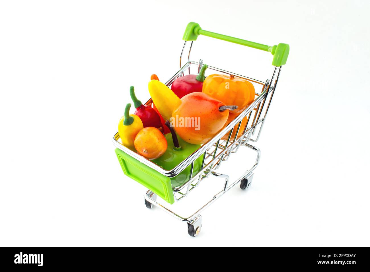 Shopping cart full of fruits and vegetables. The concept of selling and
