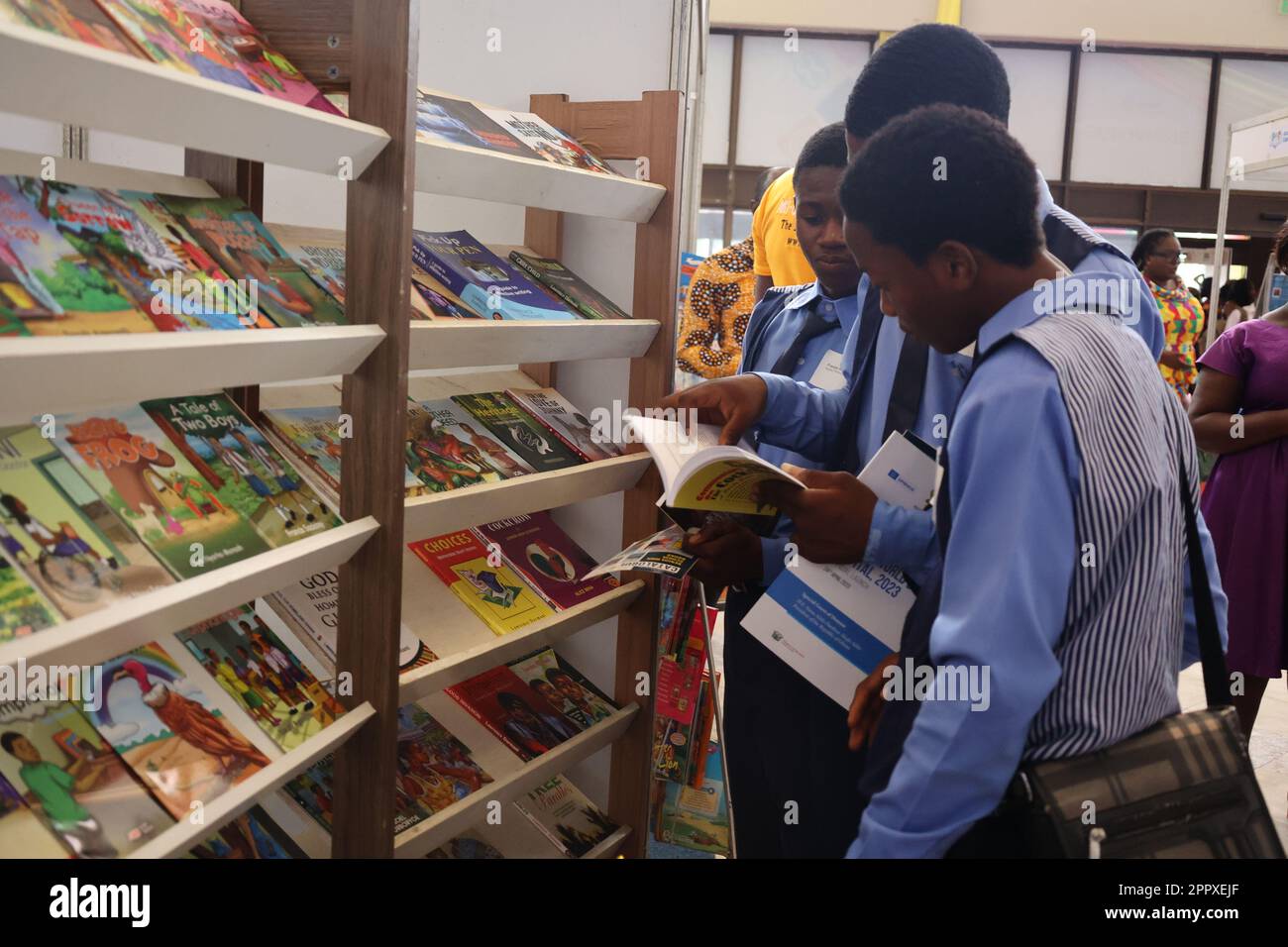 Accra, Ghana. 24th Apr, 2023. Students read books at a book exhibition