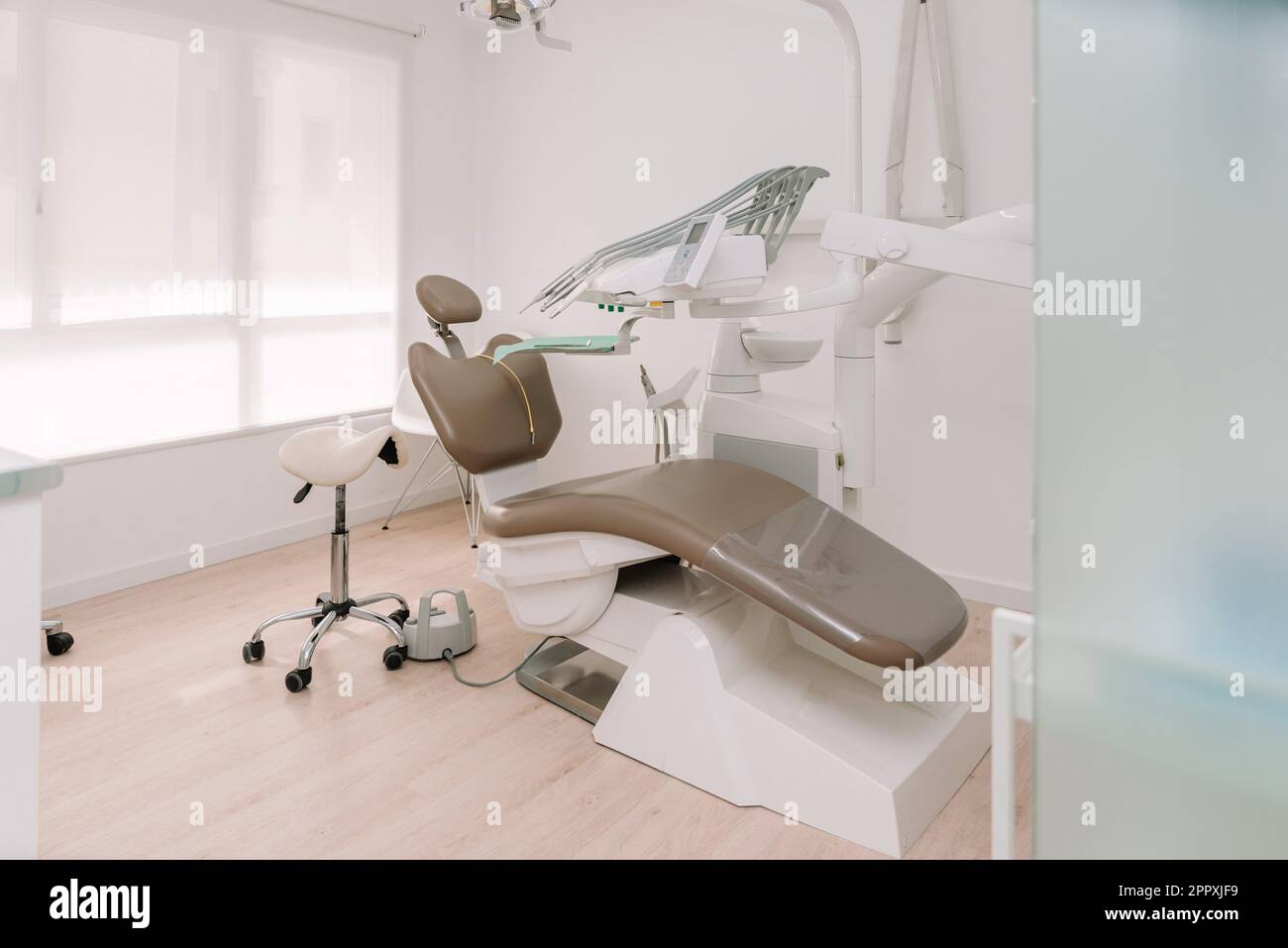 Contemporary interior of dental clinic with leather chair and dental