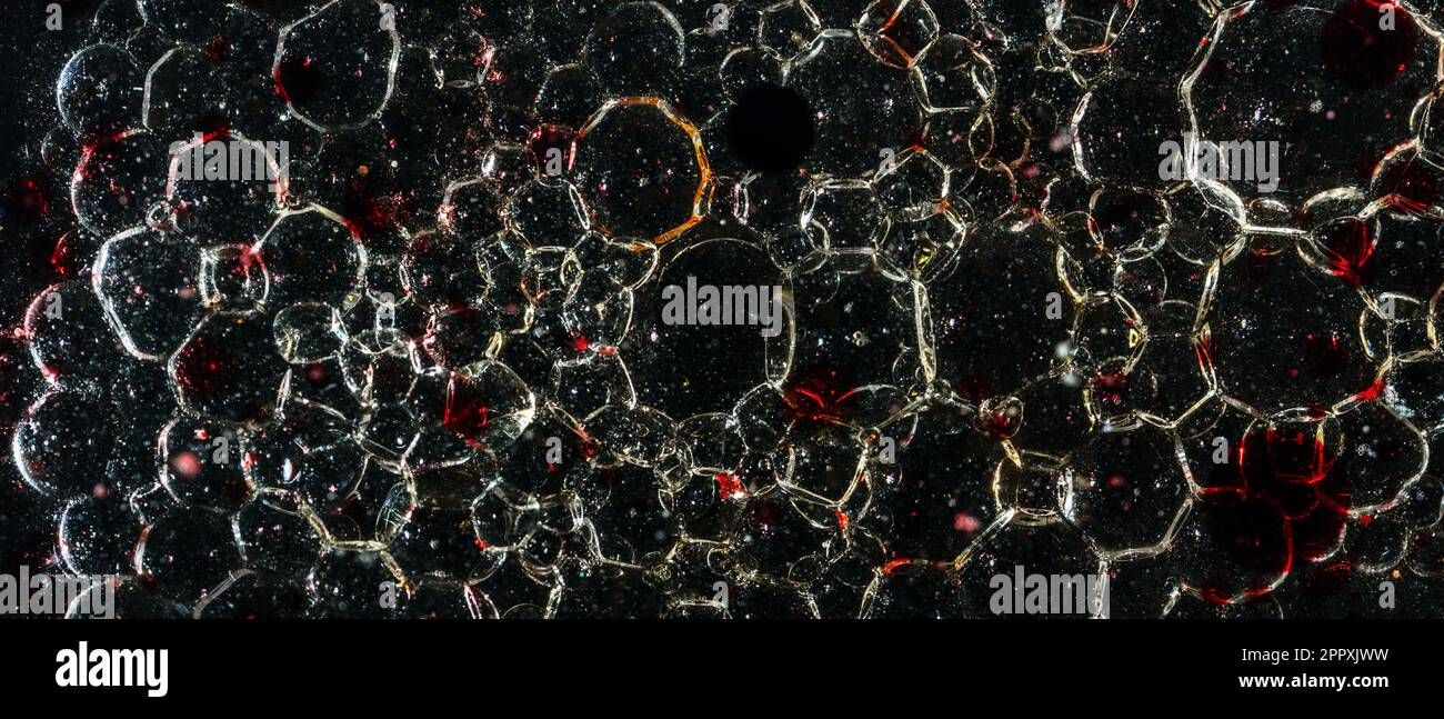 Many bubbles in dark oil Stock Photo