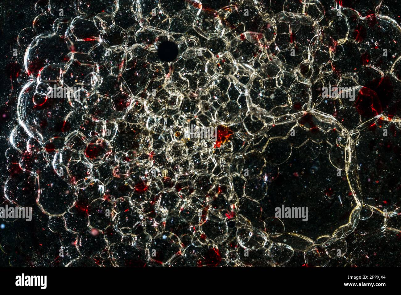 Many bubbles in dark oil Stock Photo