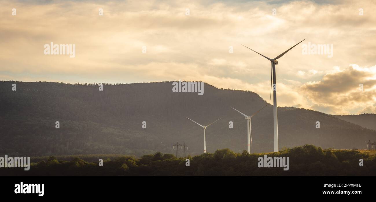 Image showcasing Wind turbines at the mountain landsape. Green power energy generation ...