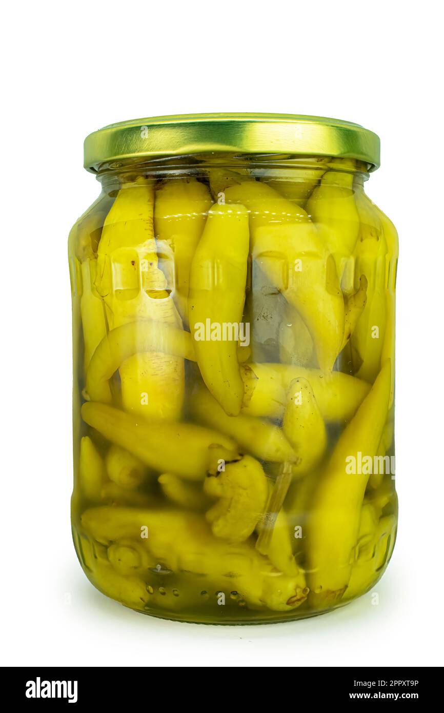 Green chili peppers jar isolated on white background top view high