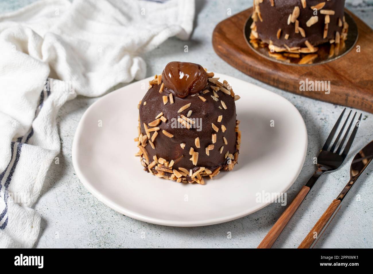 Chestnut and chocolate cake. Delicious cake with cream filling. Studio shoot. Bakery products Stock Photo