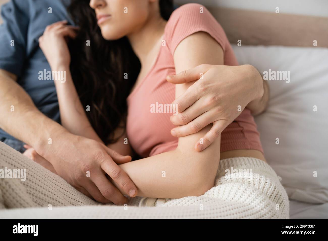 Woman hugging pillow bed hi-res stock photography and images pic picture