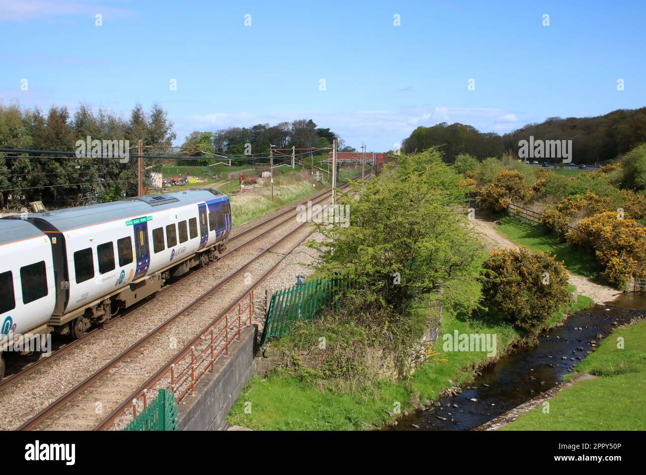 Northern Trains Civity class 195 dmu 195123 on West Coast Main Line in countryside at Woodacre near Garstang in Lancashire on 25th April 2023. Stock Photo