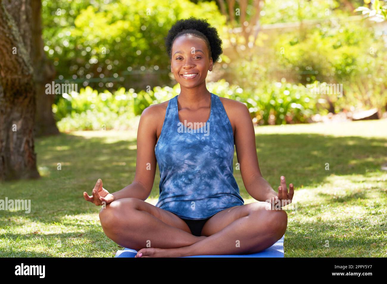 Little girl sitting in yoga pose Stock Photo - Alamy