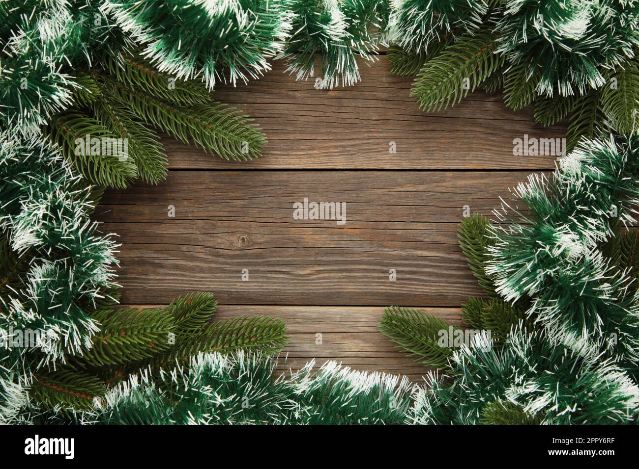 Christmas and New Year holiday background. Green tinsel and firtree
