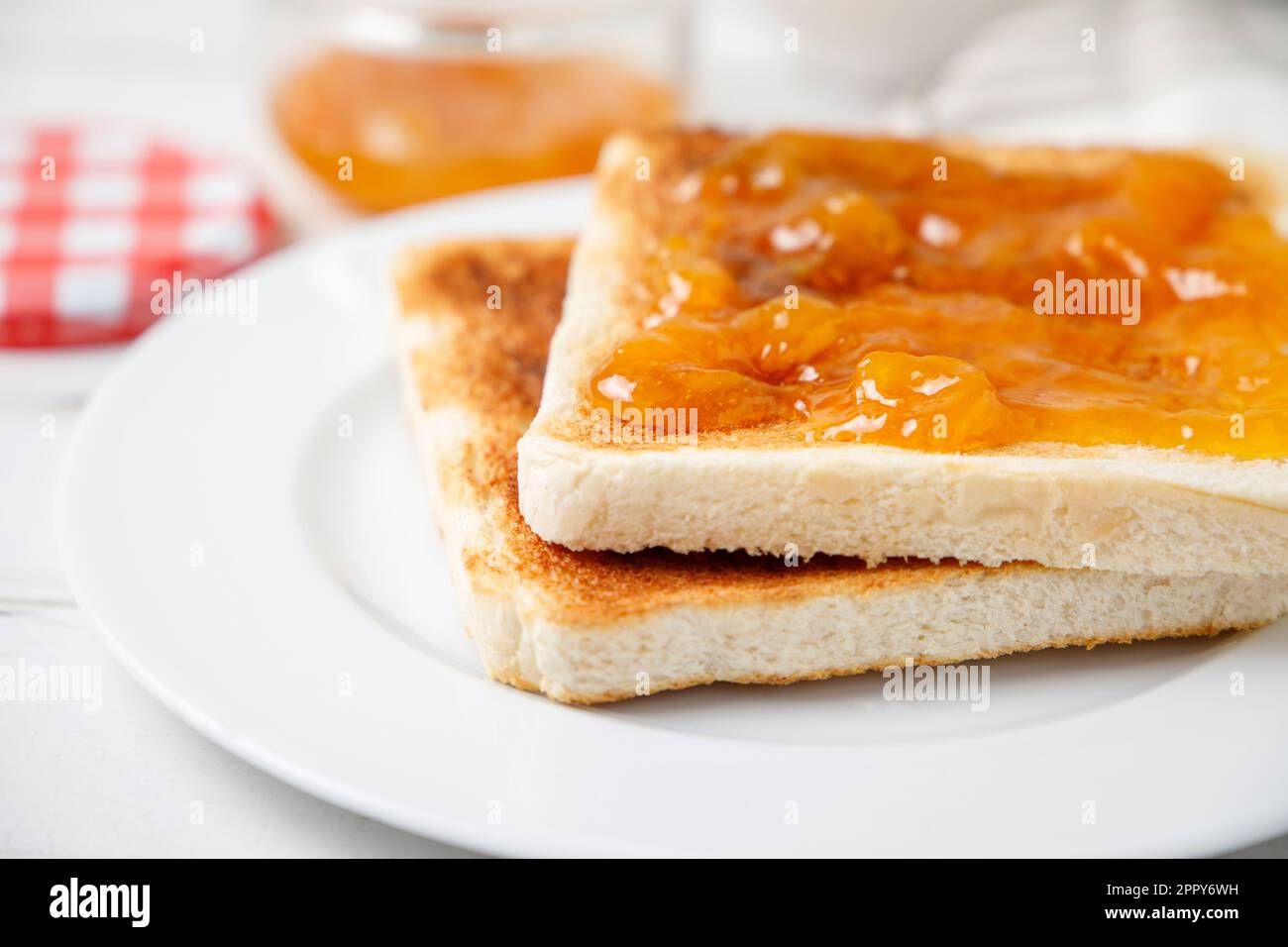 Breakfast of toast with peach jam Stock Photo
