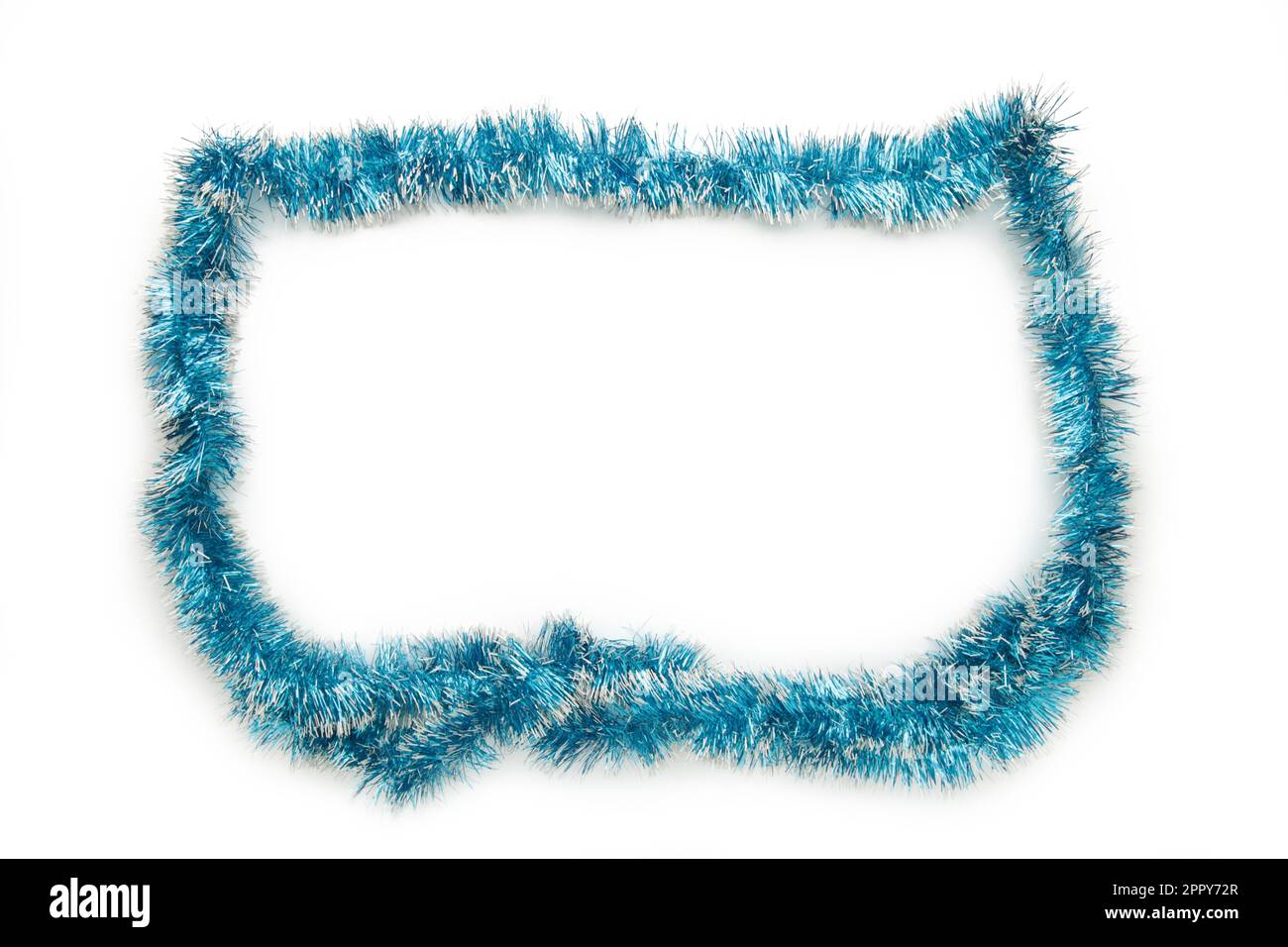 Christmas blue tinsel isolated on white background. Stock Photo