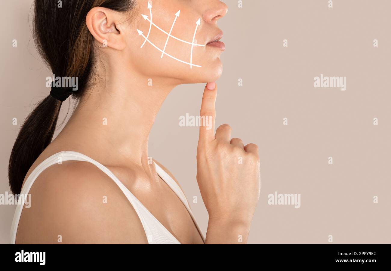 Side view of unrecognizable lady with lifting arrows on cheek Stock Photo