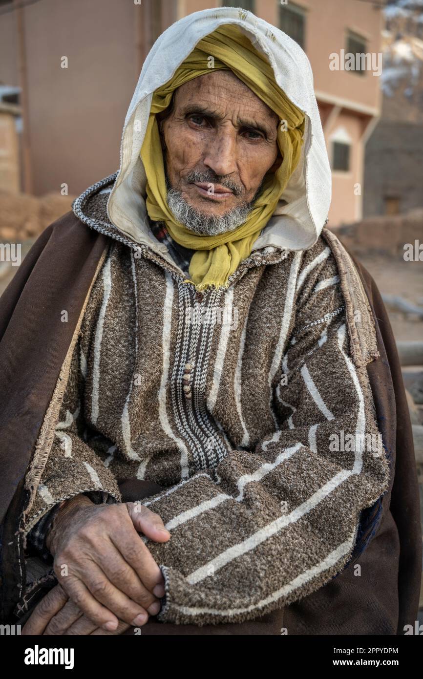 Portrait of a Berber man dressed in a traditional djellaba and turban in a village near the Dades gorge. Stock Photo