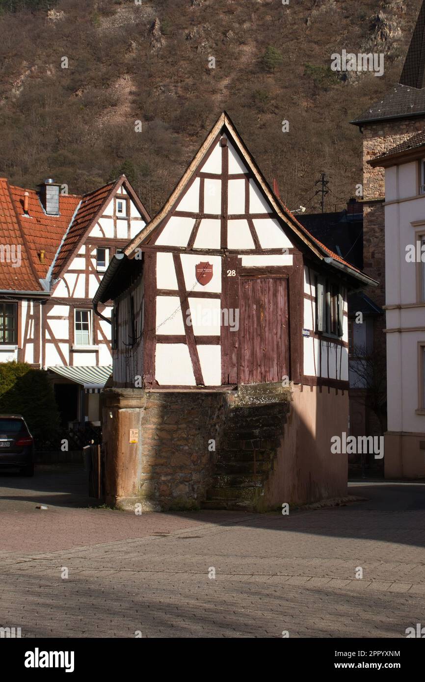 Bad Munster, Germany - February 25, 2021:Small white and brown house on a street in front of Rotenfels in Bad Munster, Germany on a sunny winter day. Stock Photo
