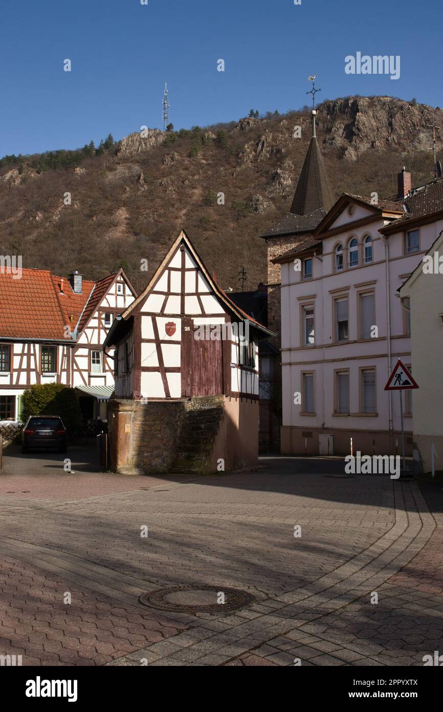 Bad Munster, Germany - February 25, 2021: Buildings on a street in front of Rotenfels in Bad Munster, Germany on a sunny winter day. Stock Photo