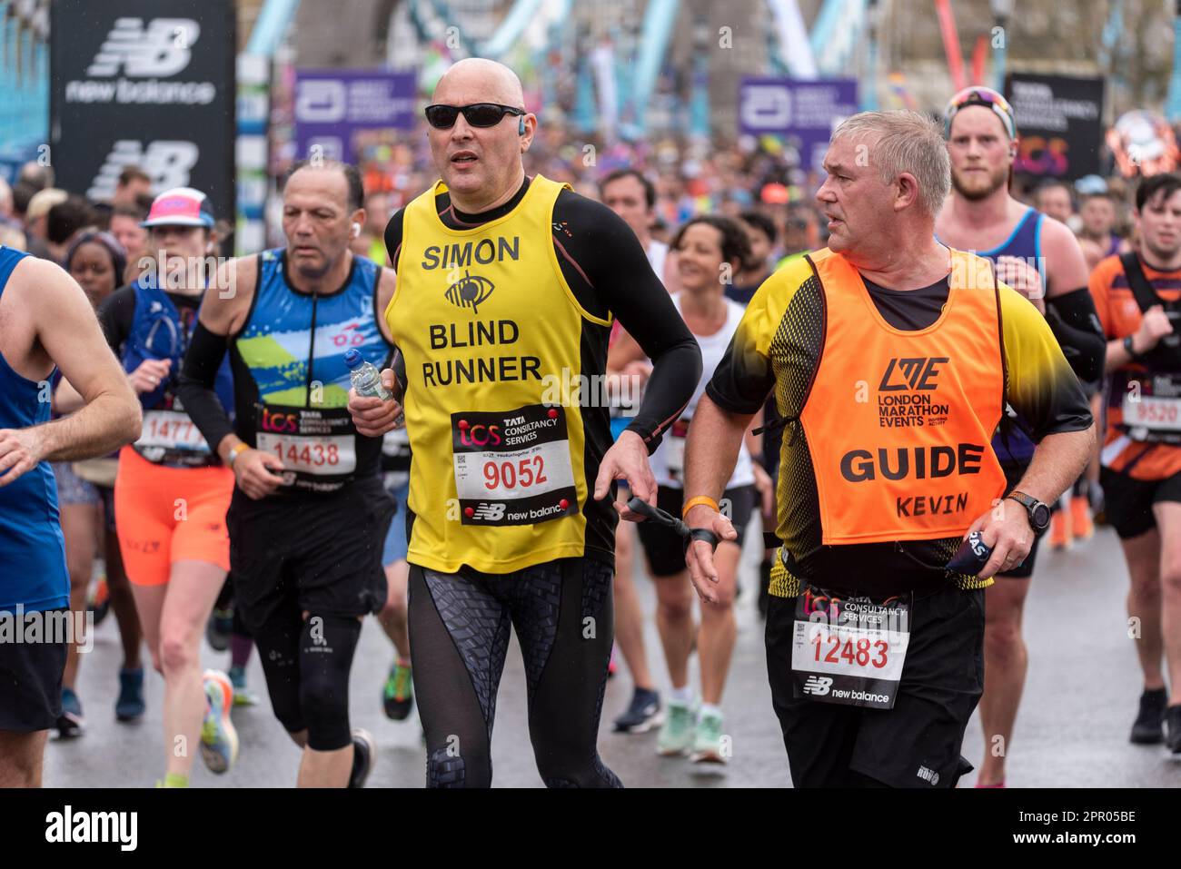 Blind runner competing in the TCS London Marathon 2023 passing through