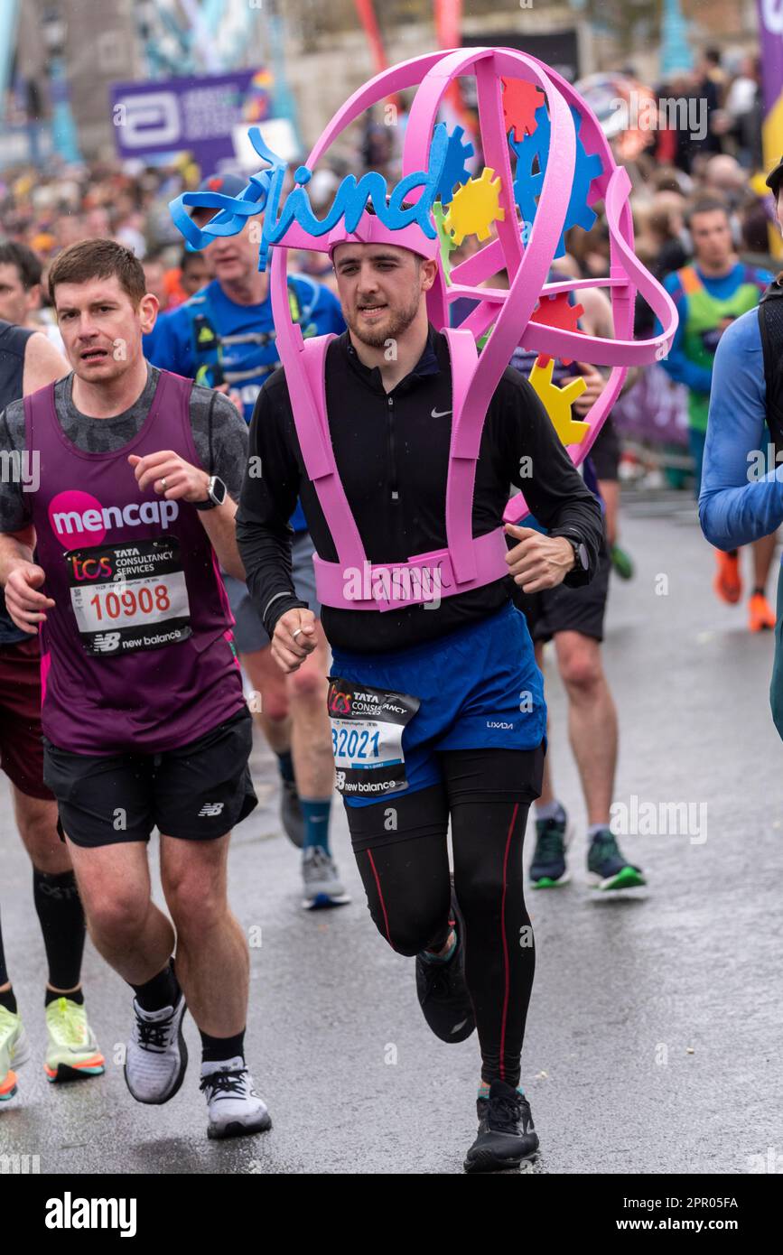 Isaac Kenyon competing in the TCS London Marathon 2023 passing through Tower Hill, London, UK. Running for Mind charity Stock Photo