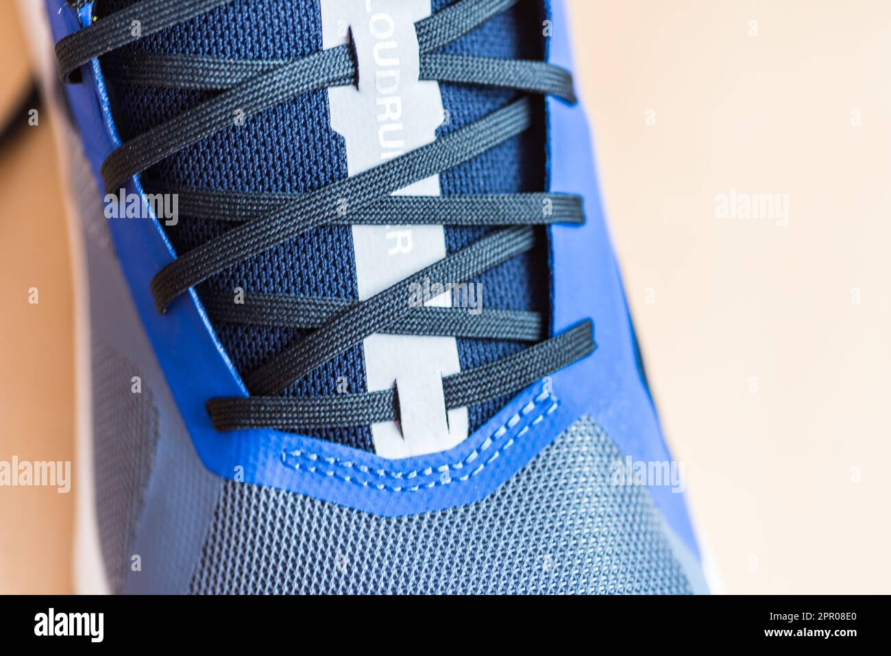 Details of Shoe showing blue laces on a running shoe Stock Photo