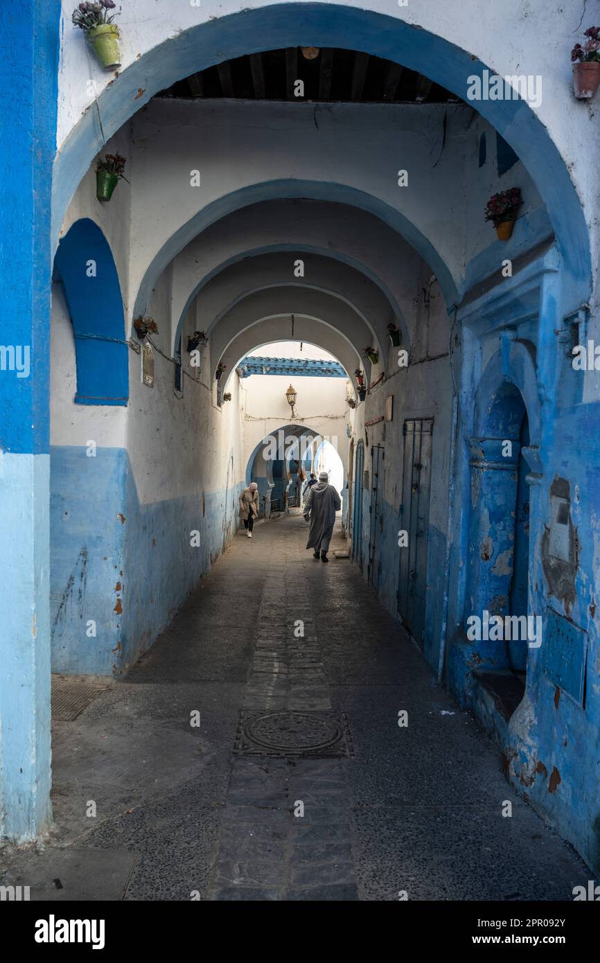 Narrow streets painted in white and blue in the medina of Larache. Stock Photo