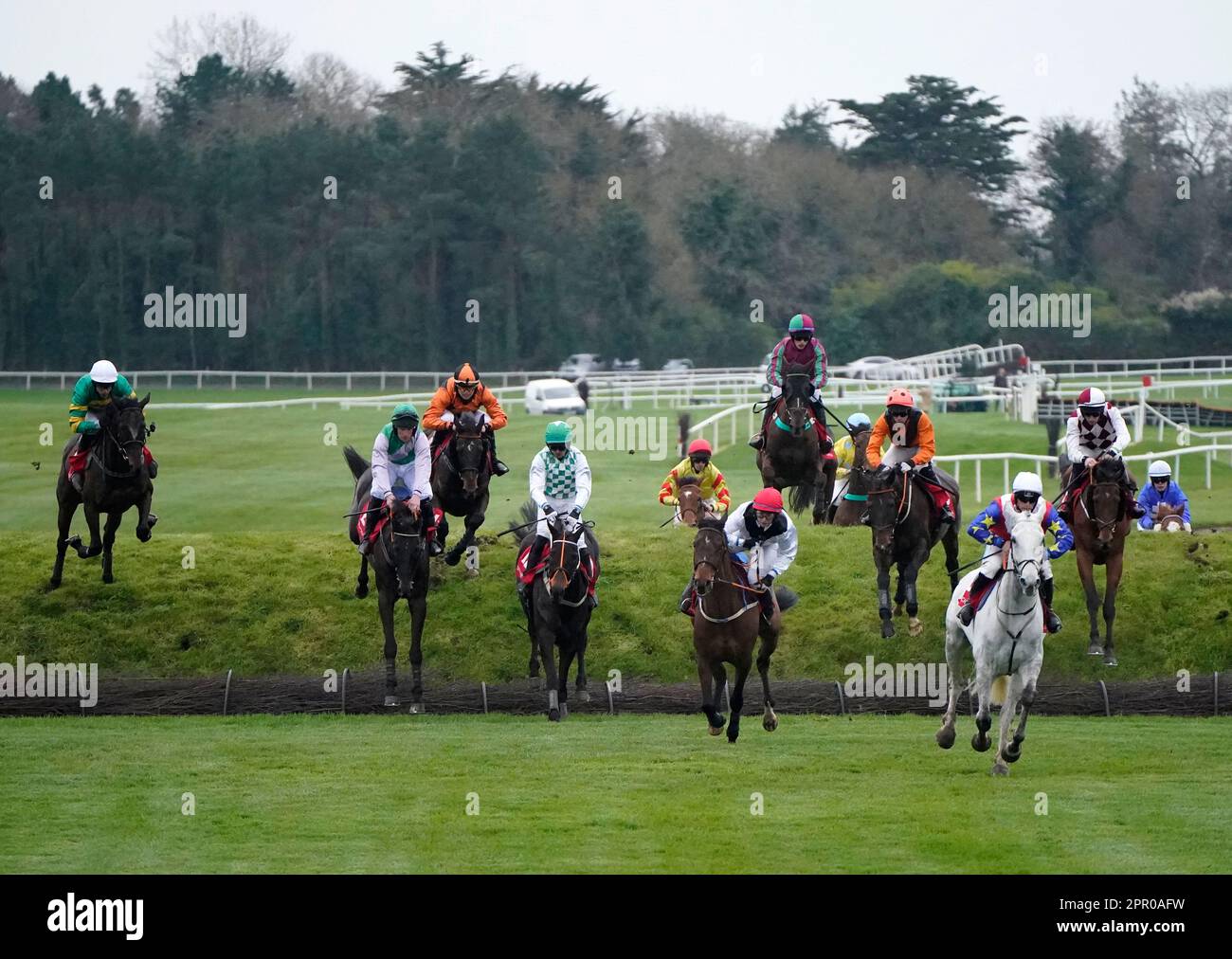 Runners and riders jump Ruby's Double in the Kildare Hunt Club Cross Country Chase for the Ladies Perpetual Cup during day one of the Punchestown Festival at Punchestown Racecourse in County Kildare, Ireland. Picture date: Tuesday April 25, 2023. Stock Photo