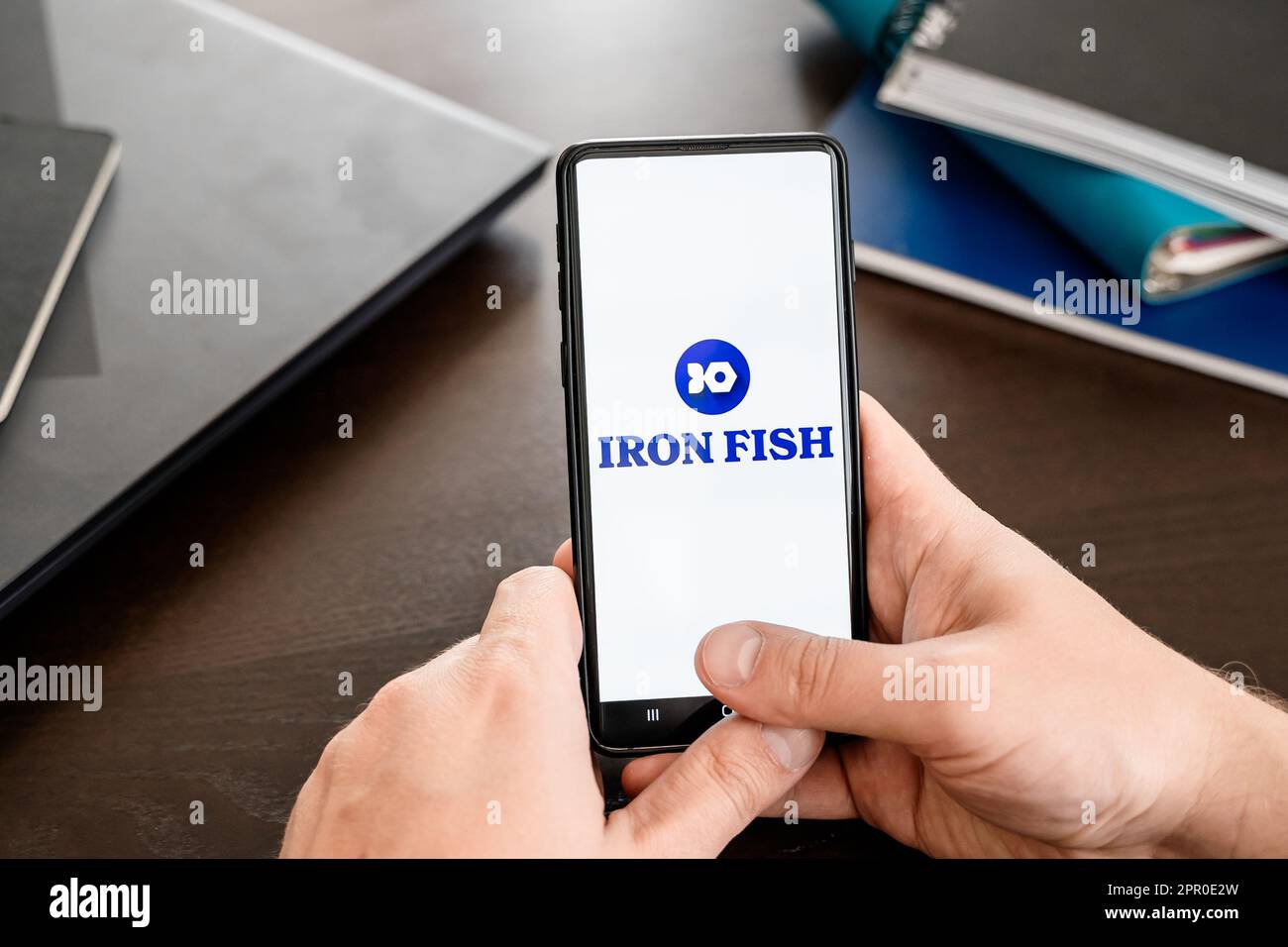 Russia Moscow 25.04.23 Logo of Iron Fish mining coin in mobile phone.  Cryptocurrency IRON token. Trading blockchain platform to buy,sell on  decentrali Stock Photo - Alamy