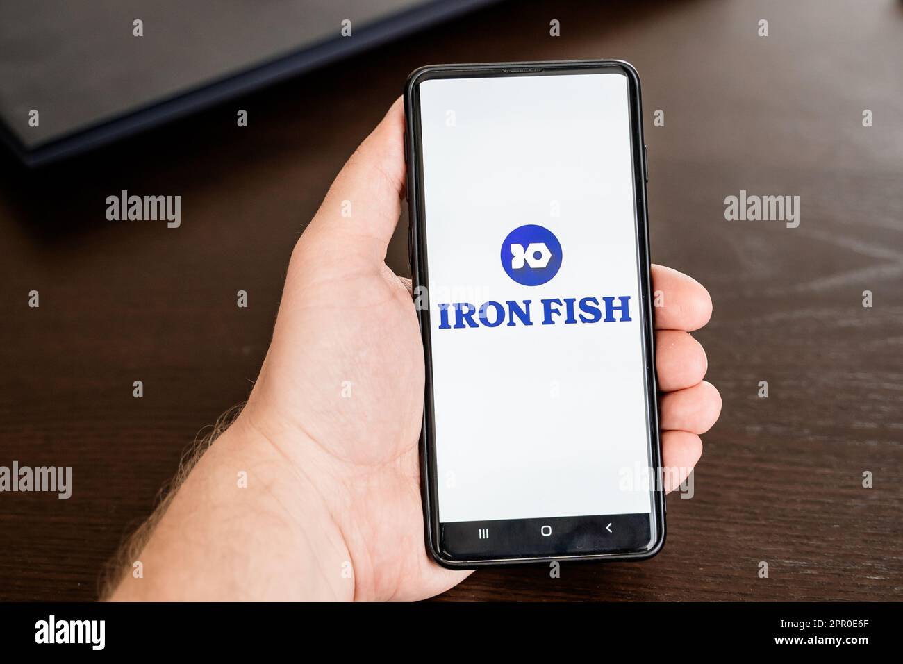 Russia Moscow 25.04.23 Logo of Iron Fish mining coin in mobile phone.  Cryptocurrency IRON token. Trading blockchain platform to buy,sell on  decentrali Stock Photo - Alamy