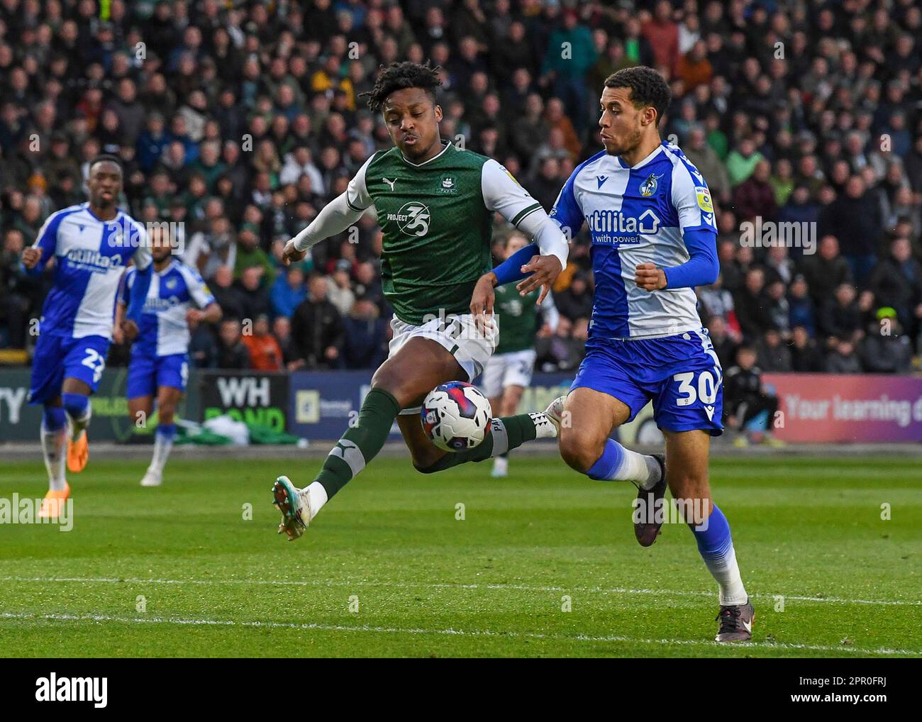 Plymouth, UK. 25th Apr, 2023. Niall Ennis #11 of Plymouth Argyle battles for the ball with with Luca Hoole #30 of Bristol Rovers during the Sky Bet League 1 match Plymouth Argyle vs Bristol Rovers at Home Park, Plymouth, United Kingdom, 25th April 2023 (Photo by Stan Kasala/News Images) in Plymouth, United Kingdom on 4/25/2023. (Photo by Stan Kasala/News Images/Sipa USA) Credit: Sipa USA/Alamy Live News Stock Photo
