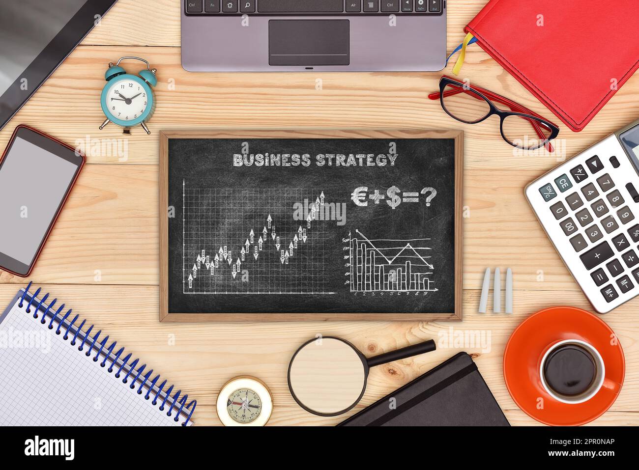 Blackboard with drawing strategy for success and business objects on ...