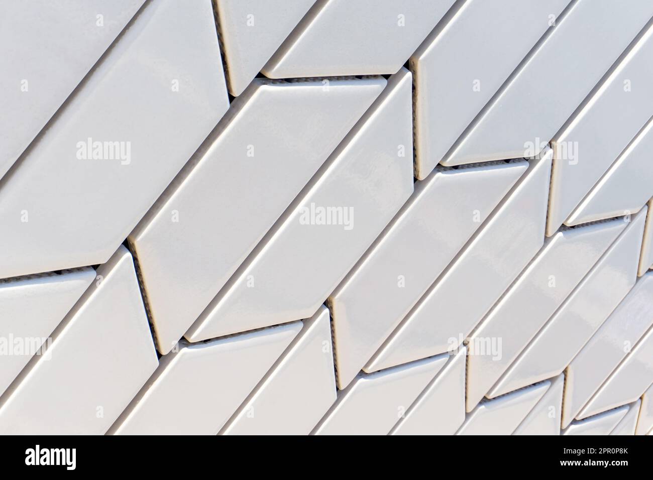 Angled white tile pattern perspective close up background Stock Photo