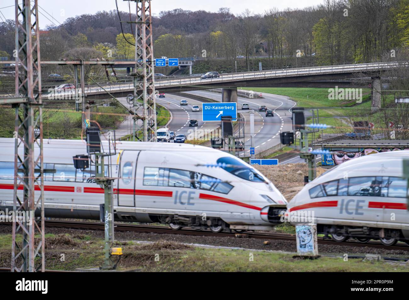 ICE train on the railway line at the Kaiserberg motorway junction, the