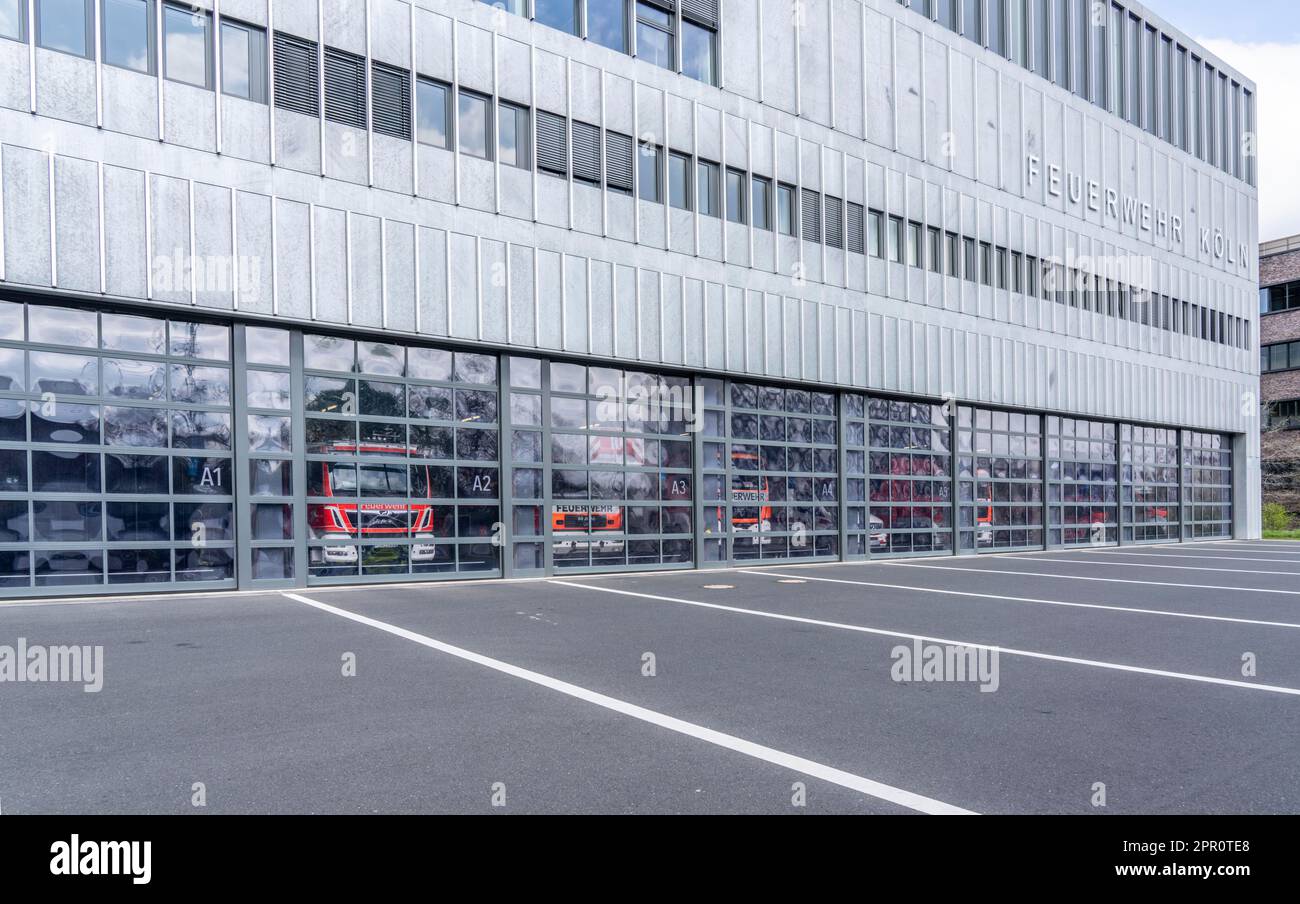 Fire brigade, fire station, modern station, glass gates, emergency vehicles standing in the vehicle hall, Cologne, NRW, Germany, Stock Photo