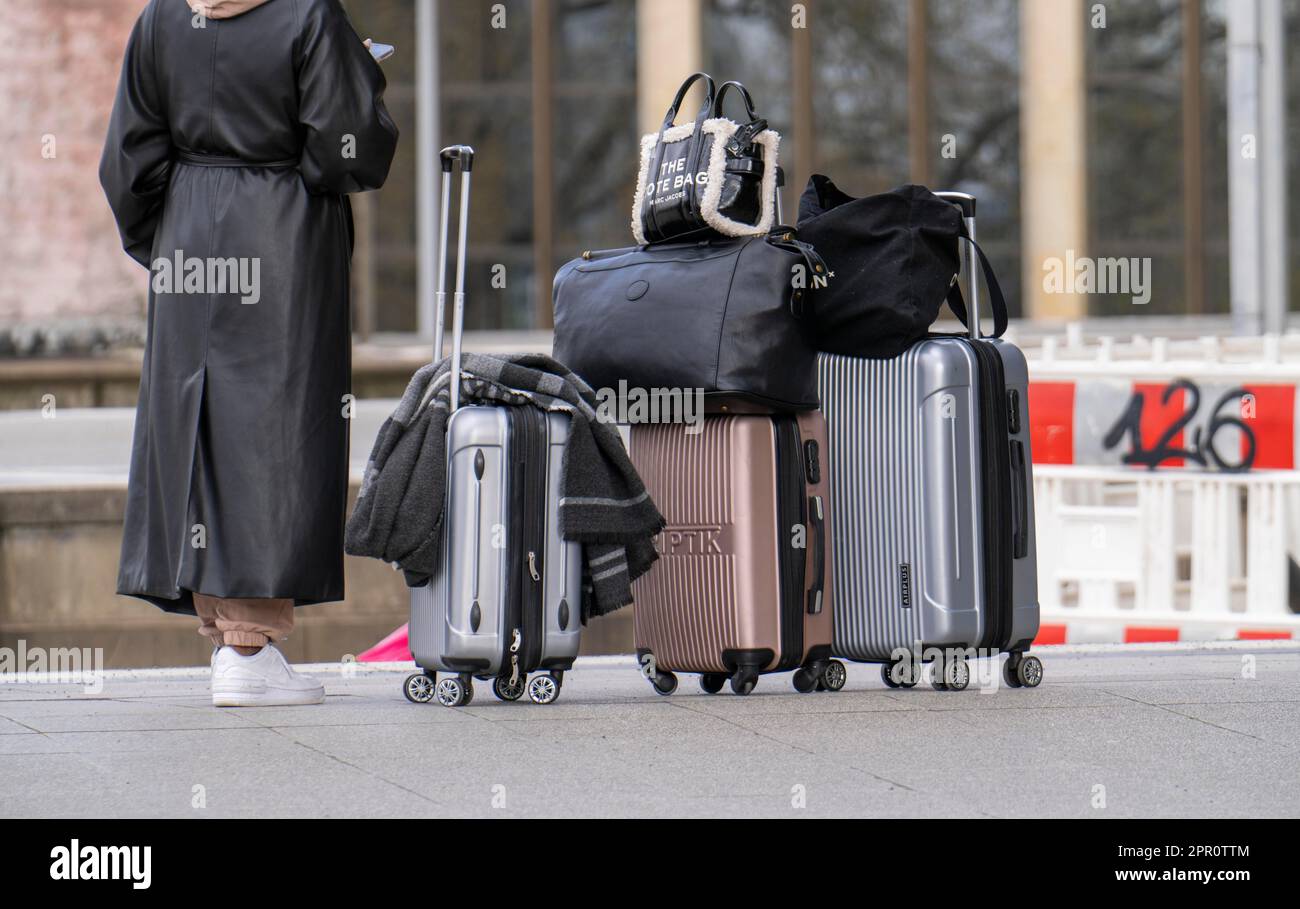 Passengers with luggage, rolling suitcases on a platform, NRW, Germany