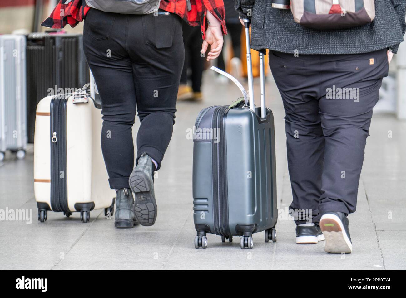 Passengers with luggage, rolling suitcases on a platform, NRW, Germany