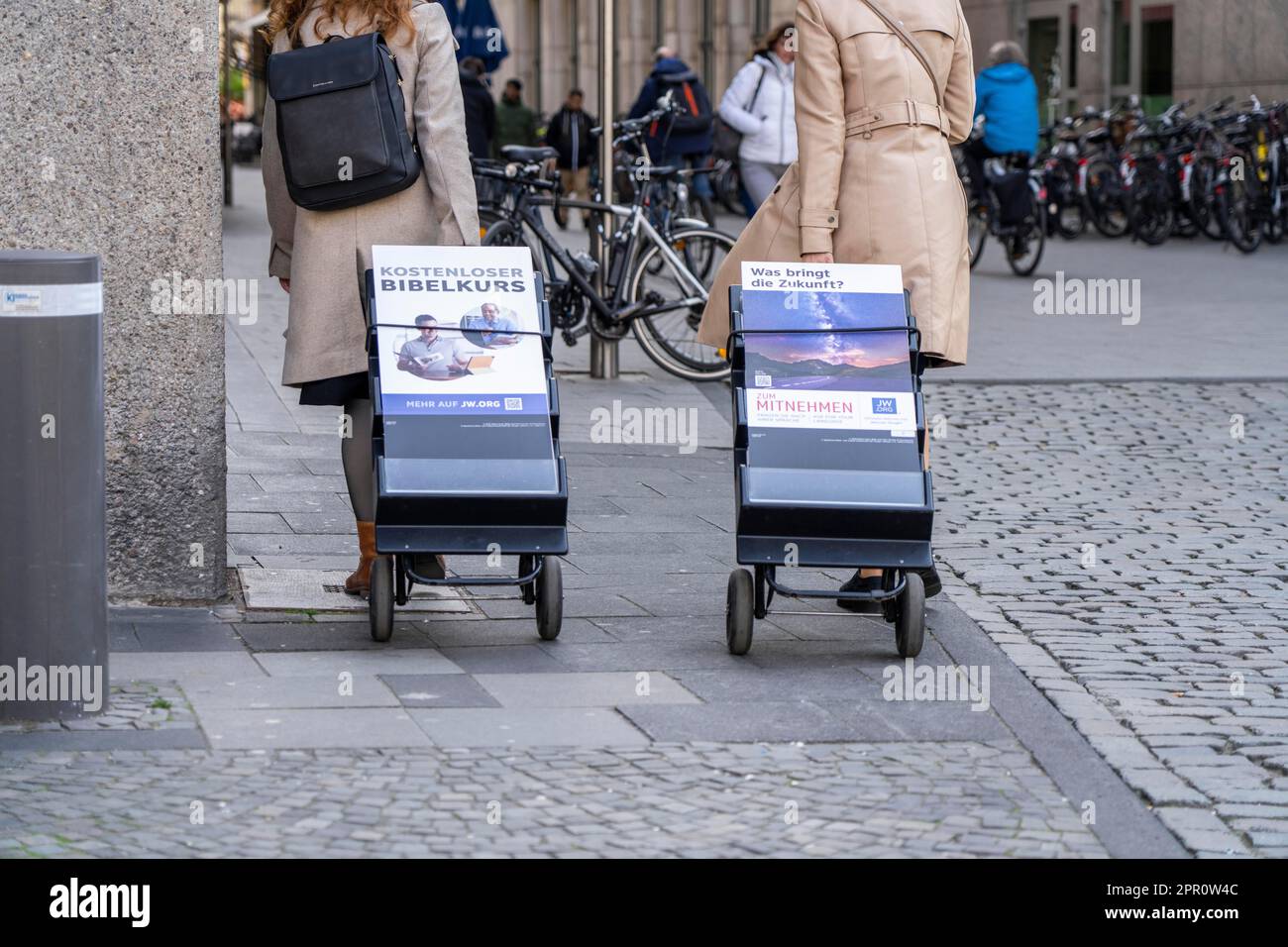 Jehovah's Witnesses with mobile information stands, with information in different languages, in the pedestrian zone near Cologne Cathedral, Stock Photo