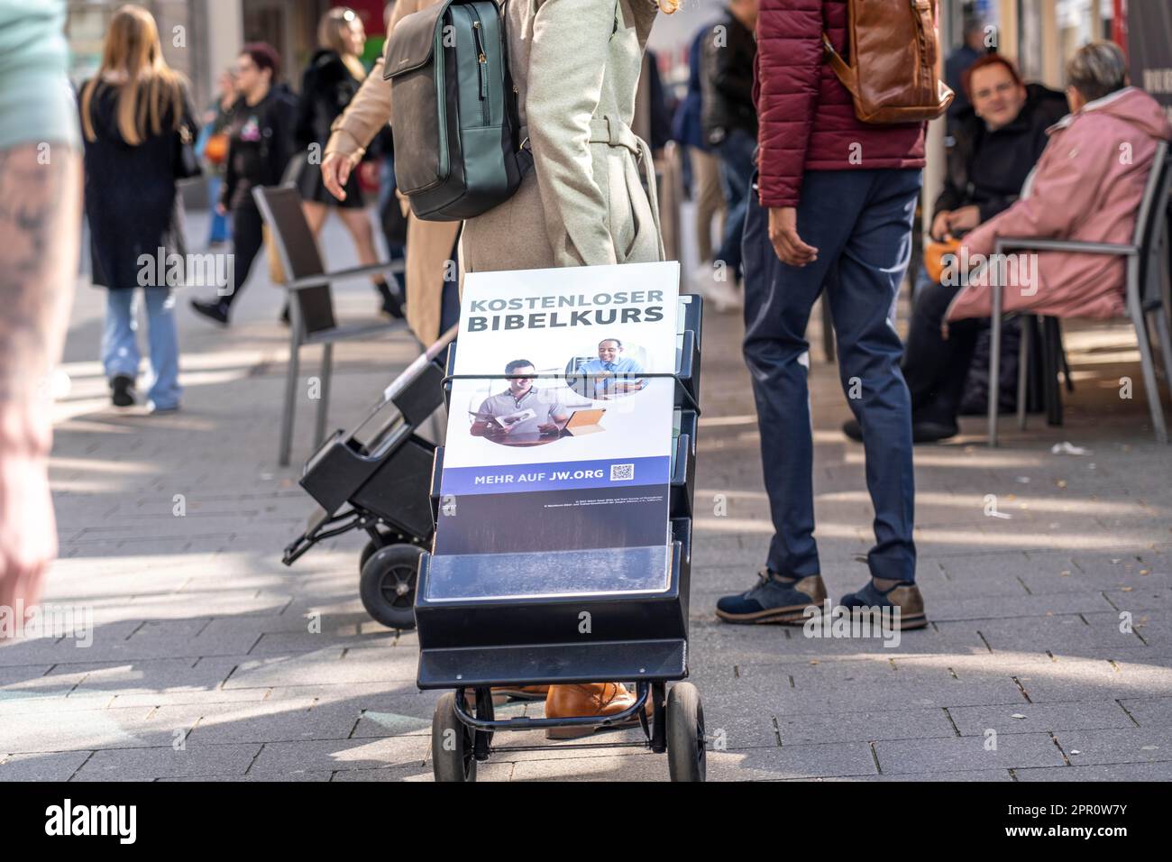 Jehovah's Witnesses with mobile information stands, with information in different languages, in the pedestrian zone near Cologne Cathedral, Stock Photo