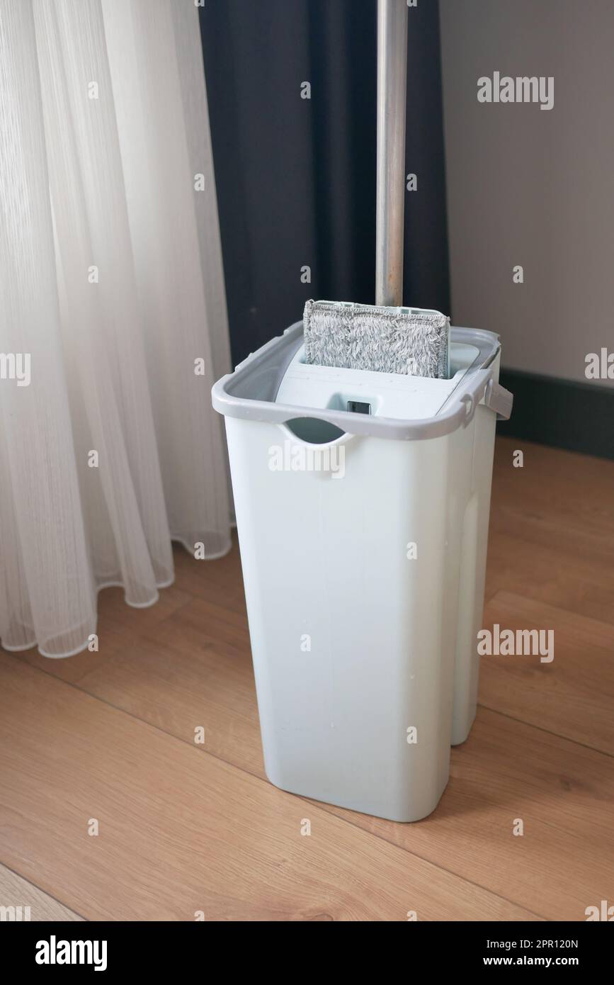 cleaning tiles floor with mop Stock Photo Alamy